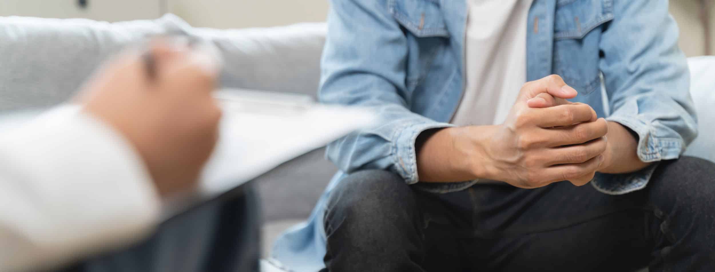 man speaking to medical professional